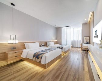 Meiye Zhenpin Hotel - Jingdezhen - Schlafzimmer