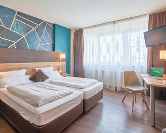 إكزو بوتيك هوتل مانهايم - مانهيم - غرفة نوم