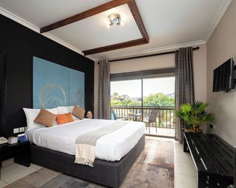 دولفين سويتس - كامبالا - غرفة نوم