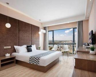 Ouye Boutique Hotel - Qujing - Habitación