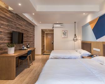 Blossom hotel in kunming - Kunming - Bedroom