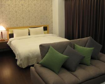 Champagne Hotel - Jiaoxi Township - חדר שינה