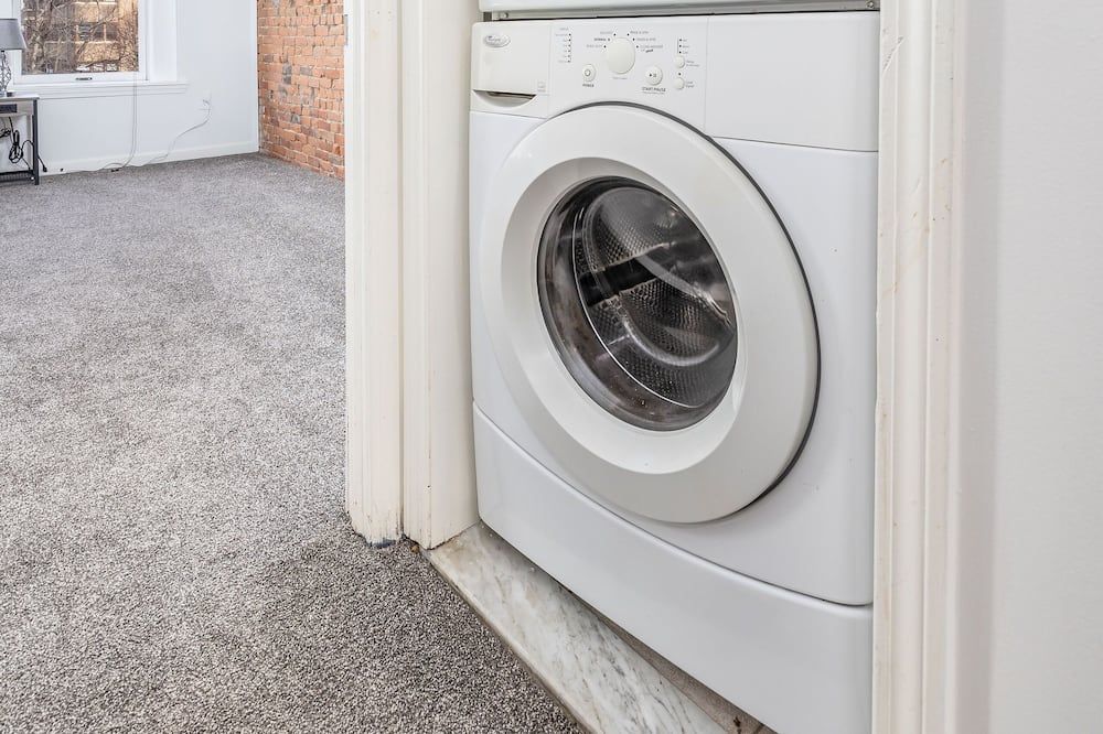 Laundry facility view of Exquisite Downtown Loft Apartment