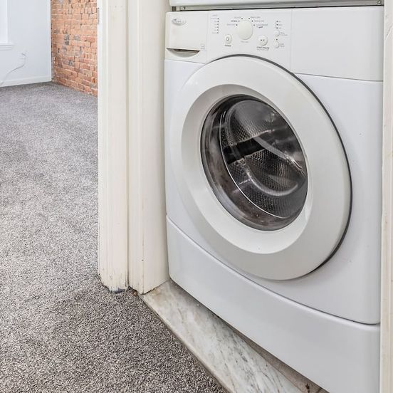 Laundry facility view of Exquisite Downtown Loft Apartment