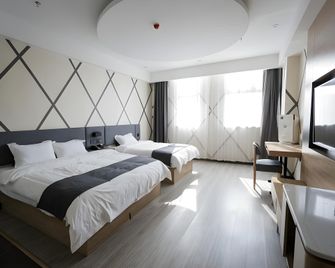 Thank Inn Plus Hotel Qingdao Licang Wan Nianquan Road - Qingdao - Kamar Tidur
