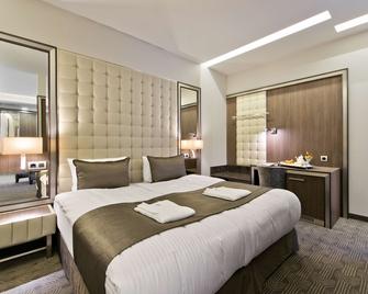 Congress Avenue Hotel - וילנה - חדר שינה