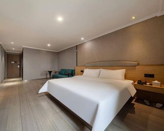 7 Days Premium Hotel (Nanchang Fuzhou Road Metro Station) - נאנצ'אנג - חדר שינה