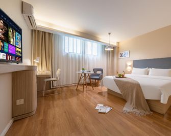 Home Inn Huayi Selected Hotel (Xichang Qionghai 17 Degrees wanda plaza Branch) - Liangshan - Bedroom