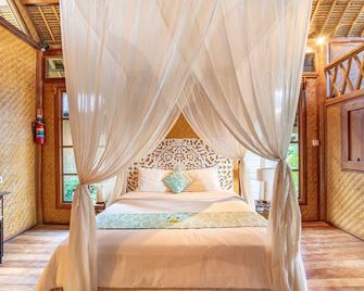 Santai Hotel - Abang - חדר שינה