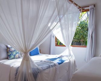 Pousada Suites Nativas - טרנקוסו - חדר שינה