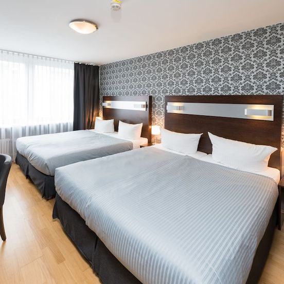 Bedroom view of Hotel Munich Inn - Design Hotel