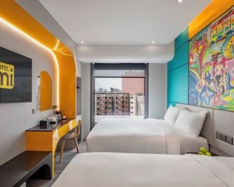 هوتل مي روتشور - سنغافورة - غرفة نوم