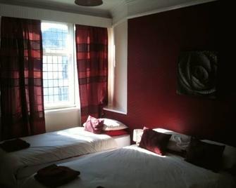 ذي سادل إن - يورك - غرفة نوم