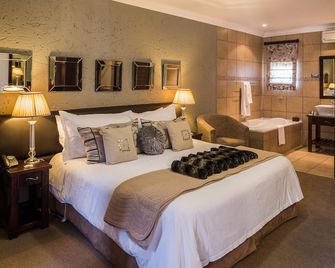 Villa Bali Boutique Hotel - בלואמפונטיין - חדר שינה