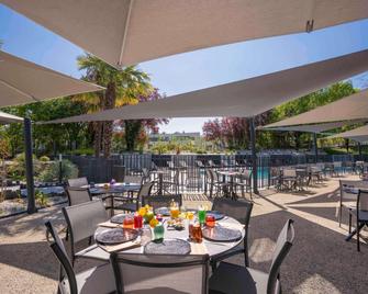 Novotel Poitiers Site du Futuroscope - שאסנווי דו-פואטו - פטיו