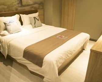 Pai Hotel Tianjin Xian Shui Gu Yuetan Shopping Center - Tianjín - Habitación