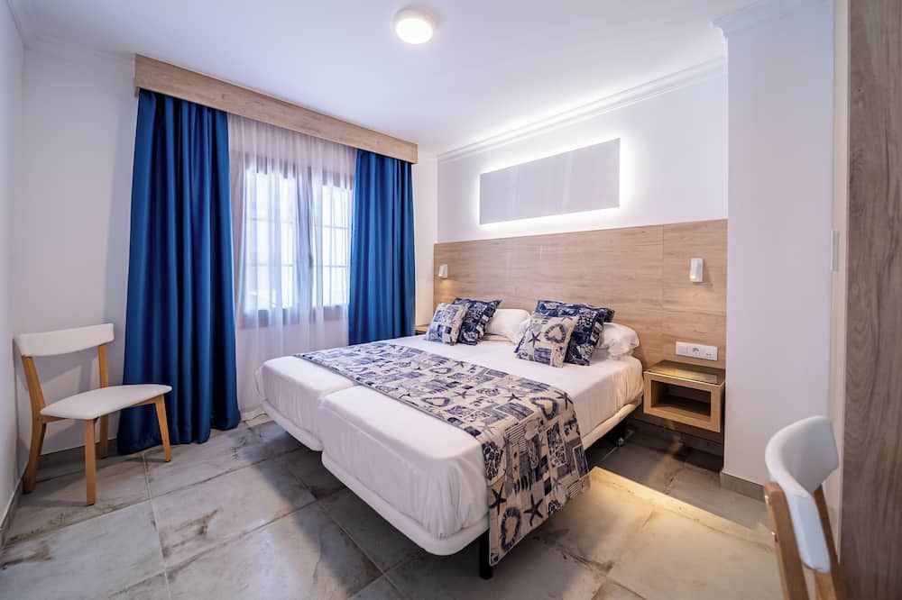 Suite Hotel Montana Club - Puerto del Carmen - חדר שינה