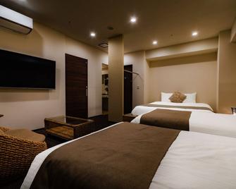 Randor Residential Hotel Sapporo Suites - Саппоро - Спальня