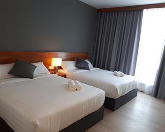 Hotin Inn - Kuching - Bedroom