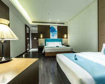 Xana Lite Hotel (Zigong Bus Terminal) - Zigong - Bedroom
