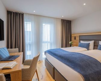 Aardo - Kind of A Hotel by Swiss Star - Döttingen - Camera da letto