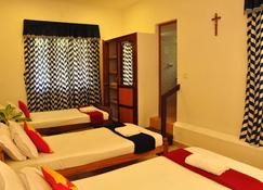 Lazar Residency Homestay - Kochi - Phòng ngủ