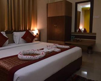 Om Leisure Resort Puri - פורי - חדר שינה