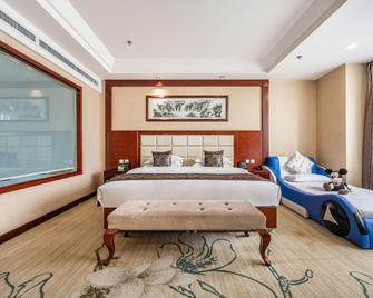 Long Fei Sheng Shi International Hotel - Yan’an - Bedroom