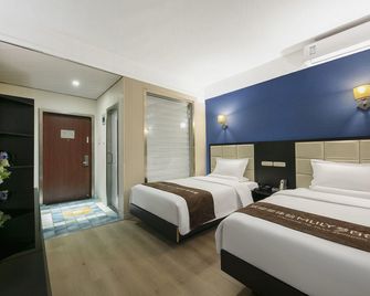 Yuanjing Holiday Hotel (Kaifeng Millennium City Park) - Kaifeng - Habitación