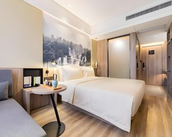 Venus International Hotel Guangxi Liuzhou High-Speed Railway Station Yufengshan Park - Liuzhou - Schlafzimmer