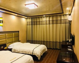 Huangguoshu Andu Hotel Guizhou Anshun - Anshun - Bedroom