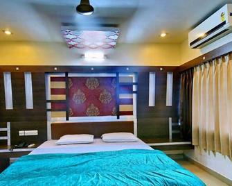 Hotel Rohini International - Digha - Bedroom