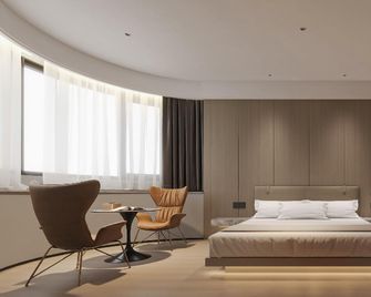 Shangrao Xinshui Man Design Hotel - Shangrao - Bedroom