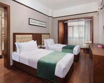 Lily Hotel (Chongqing Jiefangbei Hongya Cave Branch) - Chongqing - Bedroom