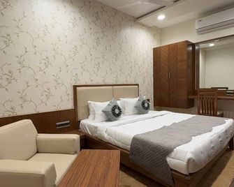 Pam Premium Hotel Vadodara - ואדודרה - חדר שינה