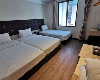 إيز هوتل - كوتا كينابالو - غرفة نوم