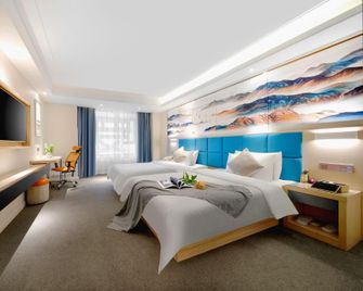 Happy Manju Hotel (Harbin West High-speed Railway Station Wanda Plaza Branch) - Harbin - Habitación