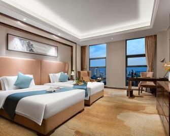 Chengkong Carrey International Hotel (Jingmen Railway Station Jingchu University of Technology) - Jingmen - Camera da letto