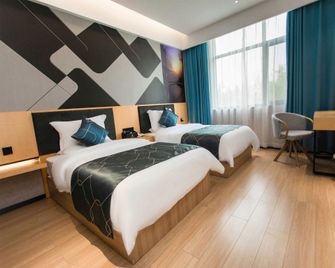 Fantastic Boutique Hotel (Jiaozuo Bo'ai Branch) - Jiaozuo - Bedroom