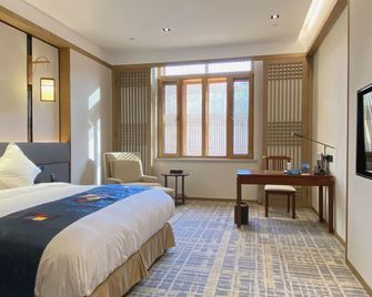Yanbian Hotel - Yanbian - חדר שינה