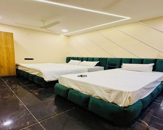 Hotel Naagshree - אויאיין - חדר שינה