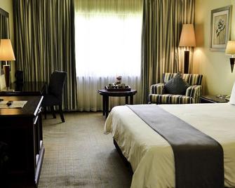 The Carousel Hotel - Temba - Bedroom