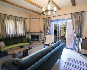 Chaihoutes stone villa into Olive farm in Zia - Asfendiou - Living room