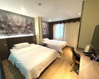 7 Days Inn Guanghan Zhong Yang Xin Cheng Branch - Deyang - Bedroom