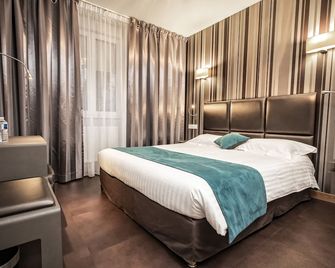 أوتل دورليون - أورليون - غرفة نوم