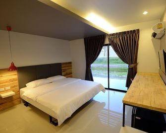 Sabye D Resort at Surat - סוראט תאני - חדר שינה