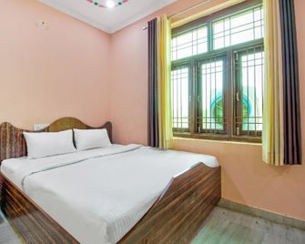 Hotel O Kukas Guest House - Āmer - Schlafzimmer