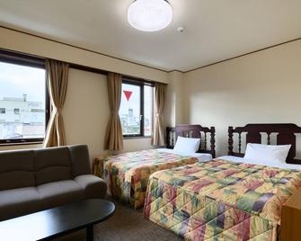 Tabist Business Hotel Osamura - Sabae - Camera da letto