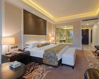Oriental International Hotel - Yichang - Schlafzimmer