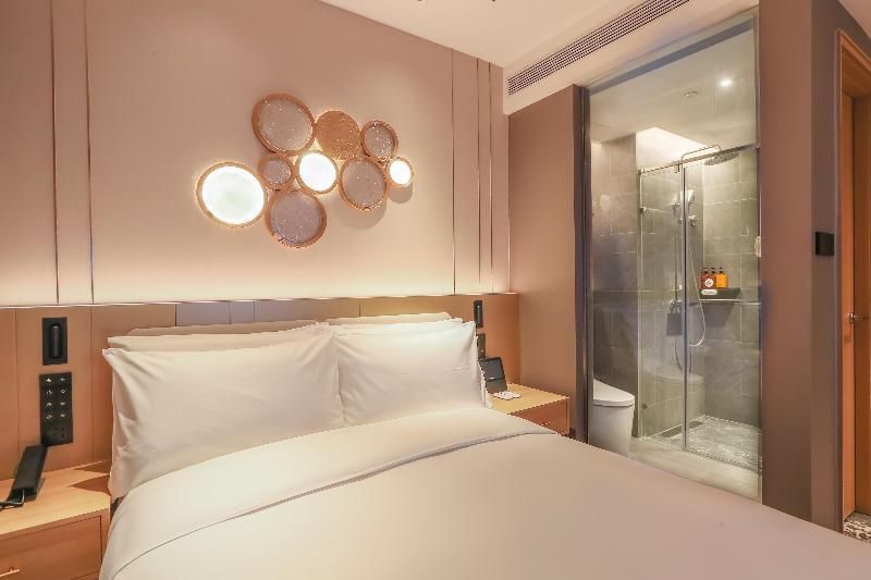 Orange Hotel (Tianjin Wudadao) - טיאנג'ין - חדר שינה